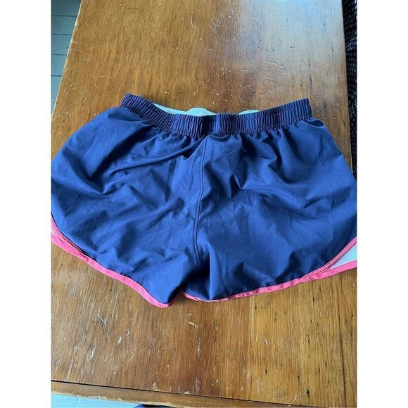 Under Armour women’s dark purple running shorts w/pink and white sides M - Picture 2 of 2